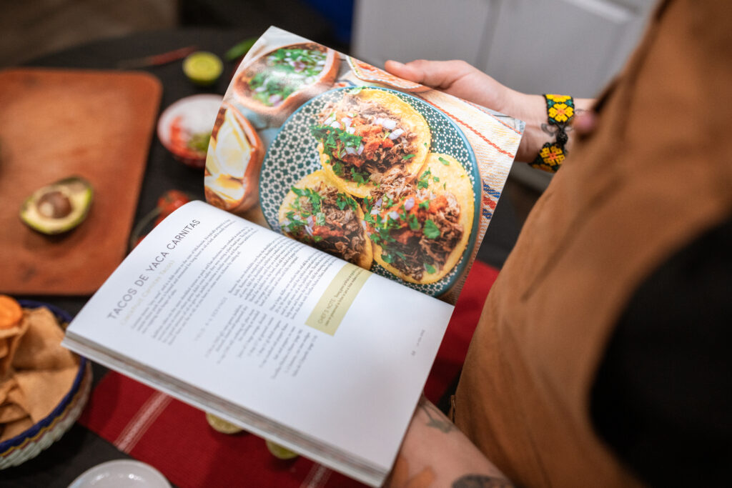 A person reading a cookbook